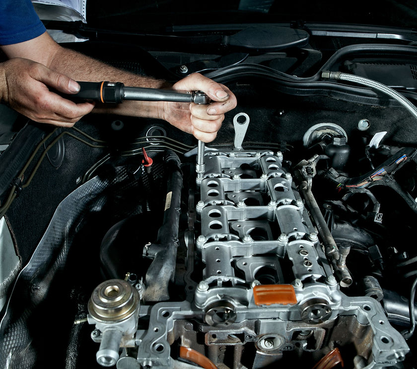 Mechanic working under a car